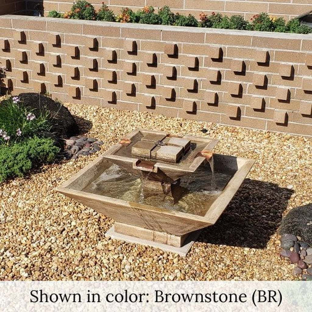 Facet Fountain on gravel in the backyard upclose