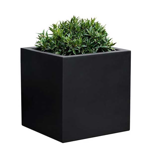 Farnley Planter 1818 S/1 in onyx black lite filled with plants against white background.