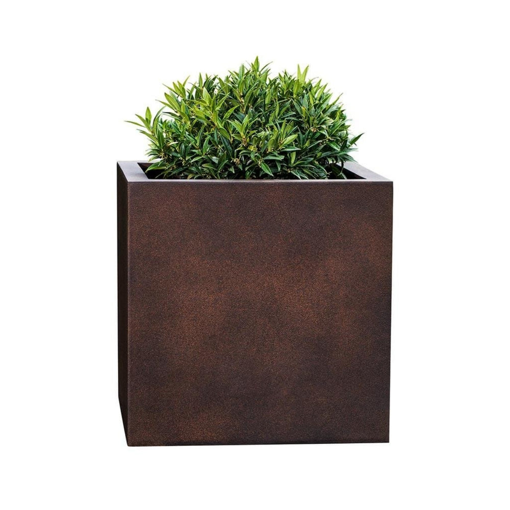 Farnley Planter 1818 S/1 in rust lite filled with plants against white background.