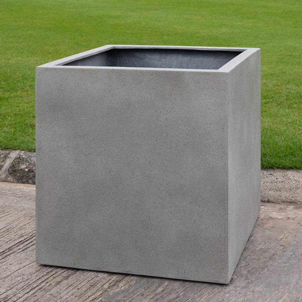 Farnley Planter 1818 S/1 in stone grey lite on concrete in the backyard.