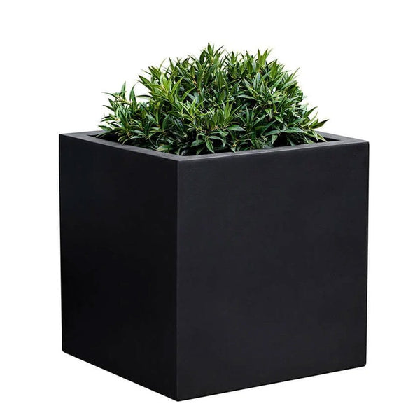 Farnley Planter 2828 S/1 in onyx black lite  filled with plants against white background.