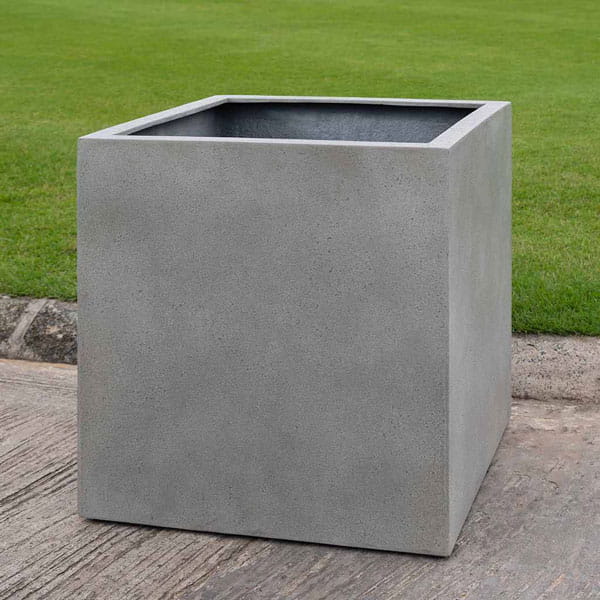 Farnley Planter 2828 S/1 in stone grey lite on concrete in the backyard.