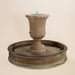 Fascea Urna Fountain against brown background.