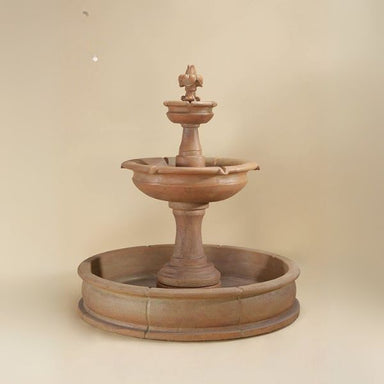 Fleur de Lis Pond Fountain against brown background.