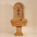 Foritalico Wall Fountain for Spout against brown background.