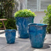 Foxglove Planter - Mediterranean - on concrete filled with plants.