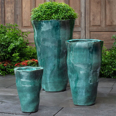 Foxglove Planter, Tall in Antique Jade on concrete in the backyard.