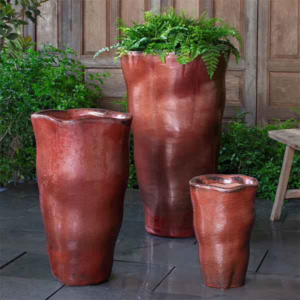 Foxglove Planter, Tall in Brunello on concrete in the backyard.