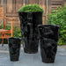 Foxglove Planter, Tall in Obsidian on concrete in the backyard