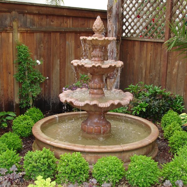 Garda Three Tier Pond Fountain in action in the garden.