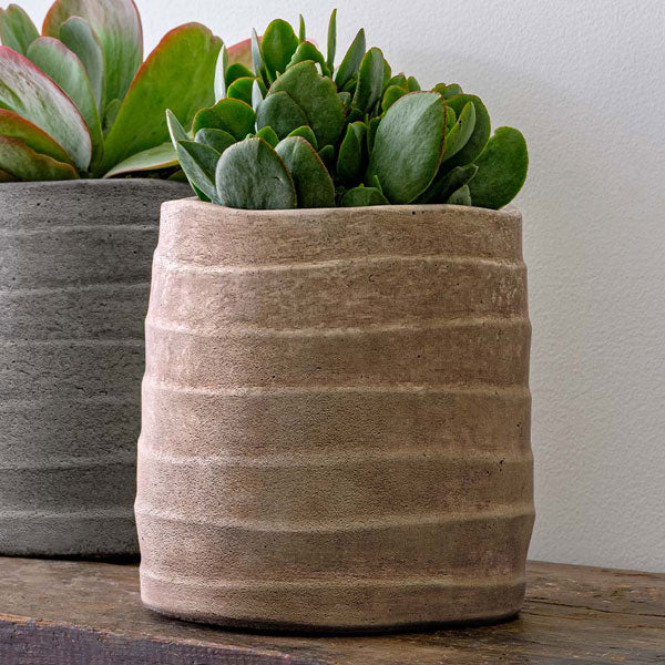 Garden Terrace Ipanema Planter on wooden table filled with plants