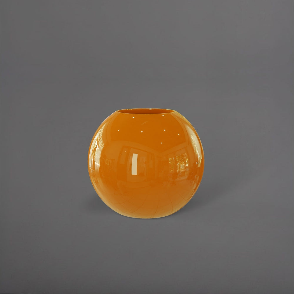 Globe Fiberglass Planter in gloss tangerine against gray background.
