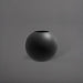 Globe Fiberglass Planter in matte charcoal against gray background.
