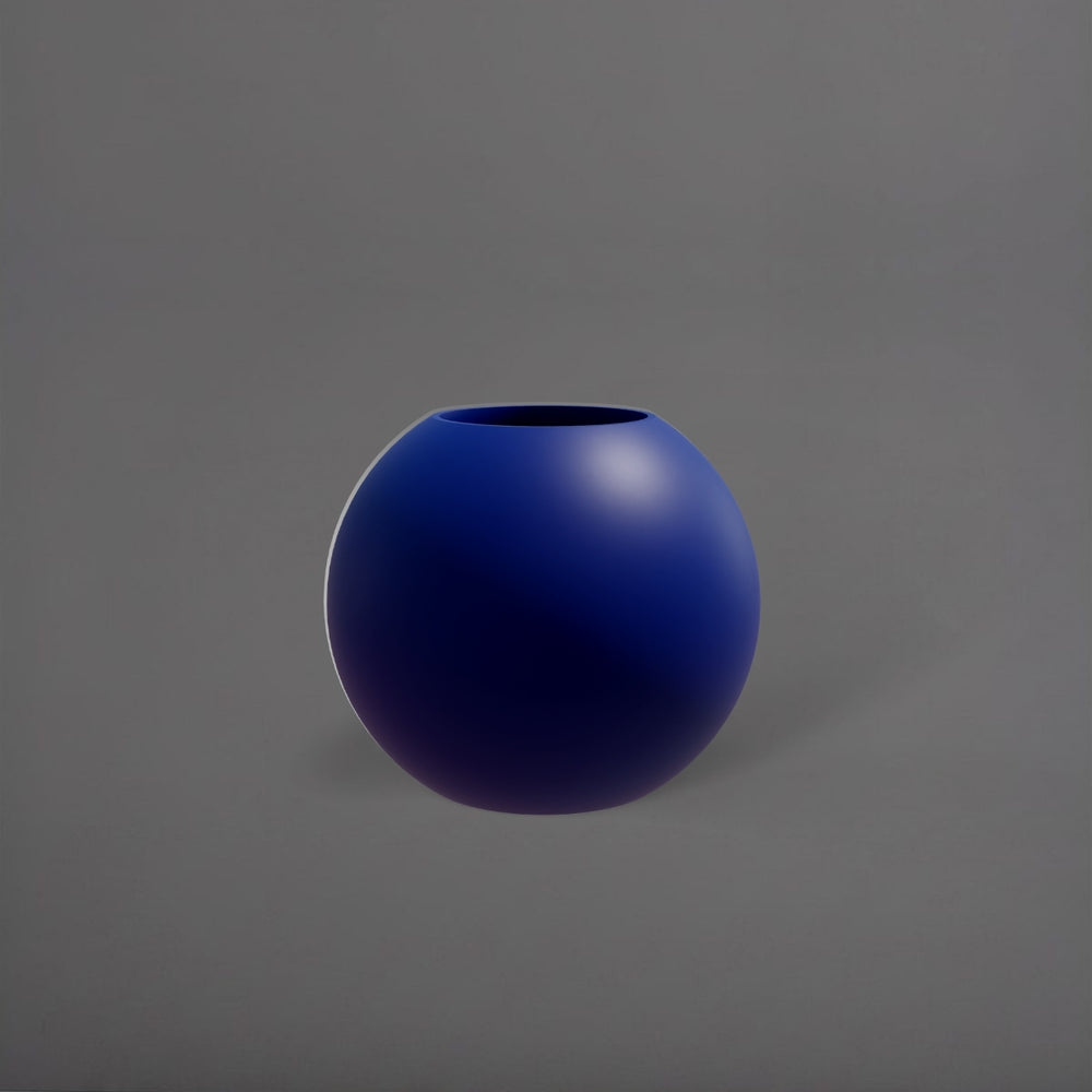 Globe Fiberglass Planter in matte cobalt blue against gray background.