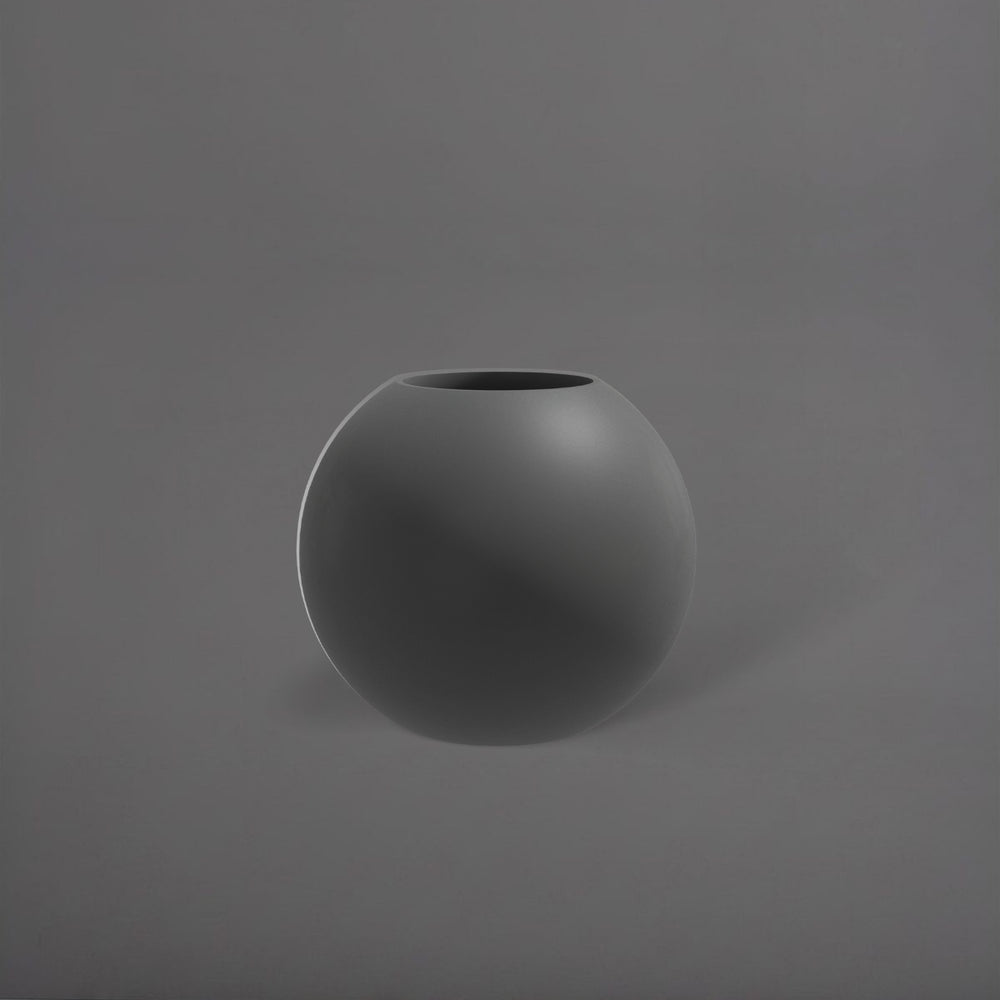 Globe Fiberglass Planter in matte gunmetal against gray background.