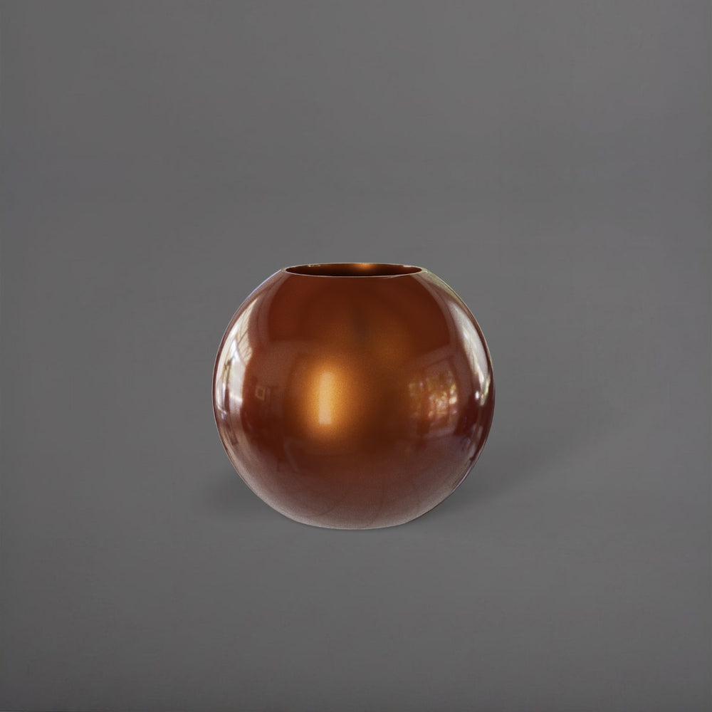 Globe Fiberglass Planter in metallic bronze against gray background.