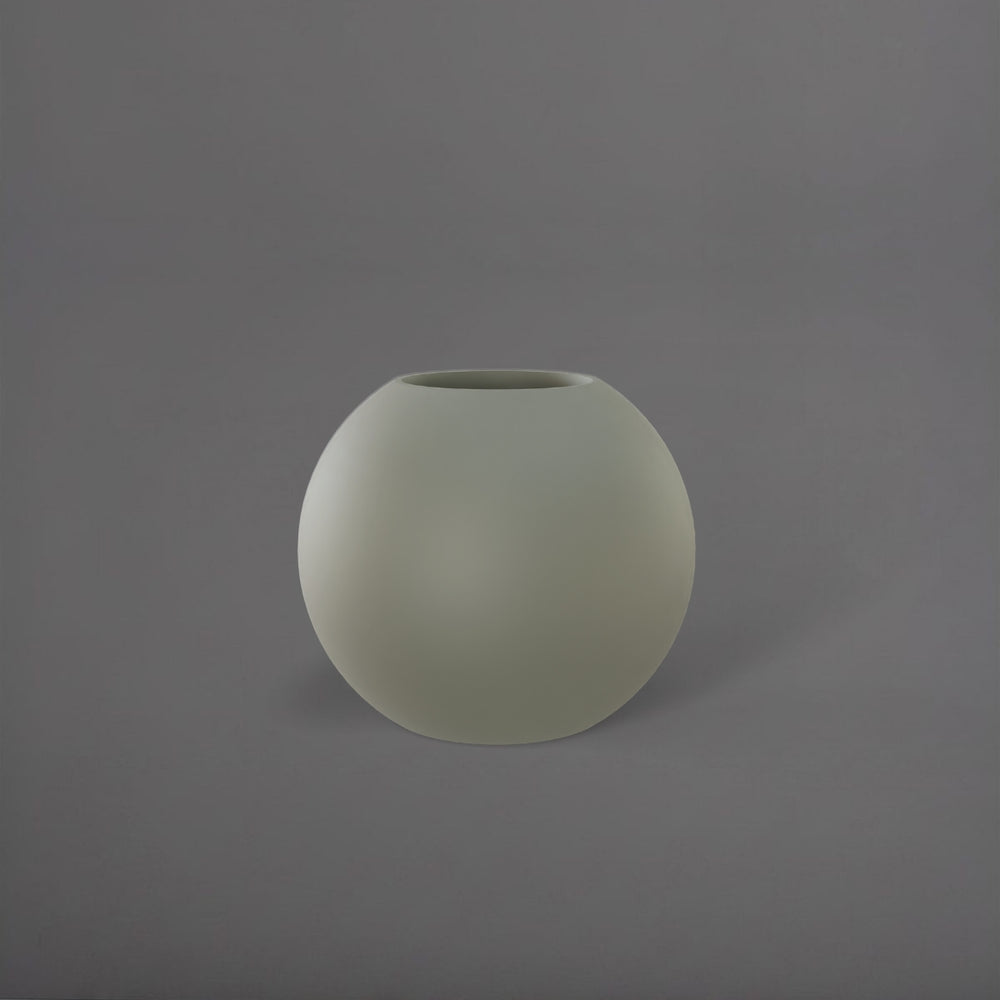 Globe Fiberglass Planter in satin beige against gray background.