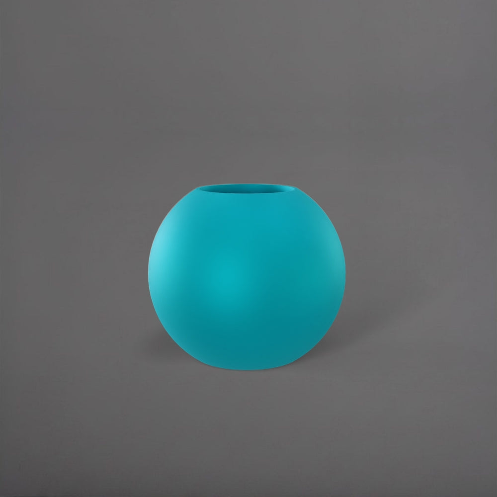 Globe Fiberglass Planter in satin seafoam green against gray background.