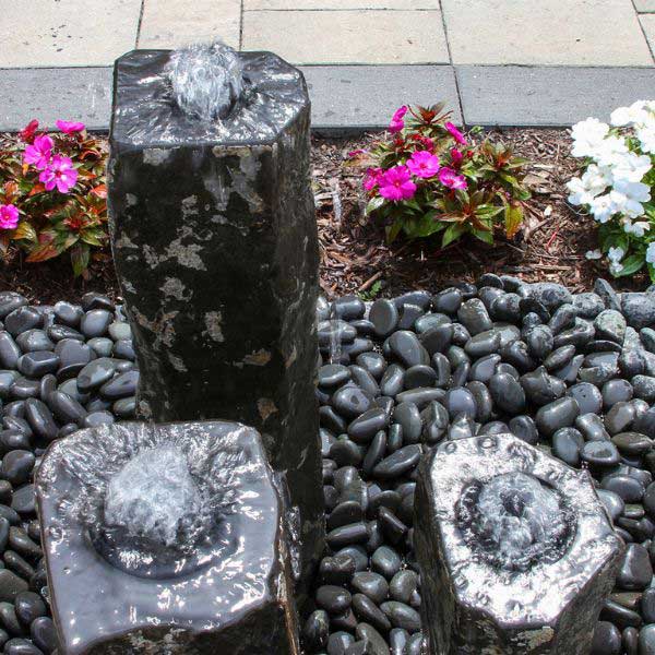 Hollowed Out Basalt fountain Kit on black pebbles in action