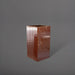 Hollywood Corner Fiberglass Planter in metallic bronze against gray background.