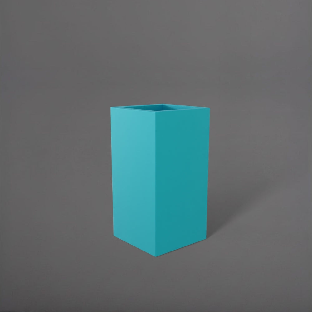 Hollywood Corner Fiberglass Planter in satin seafoam green against gray background.