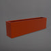 Hudson Extra Long Rectangle Fiberglass Planter in matte terra cotta against gray background.