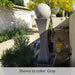 I Fountain with Ball in gray color in the backyard.
