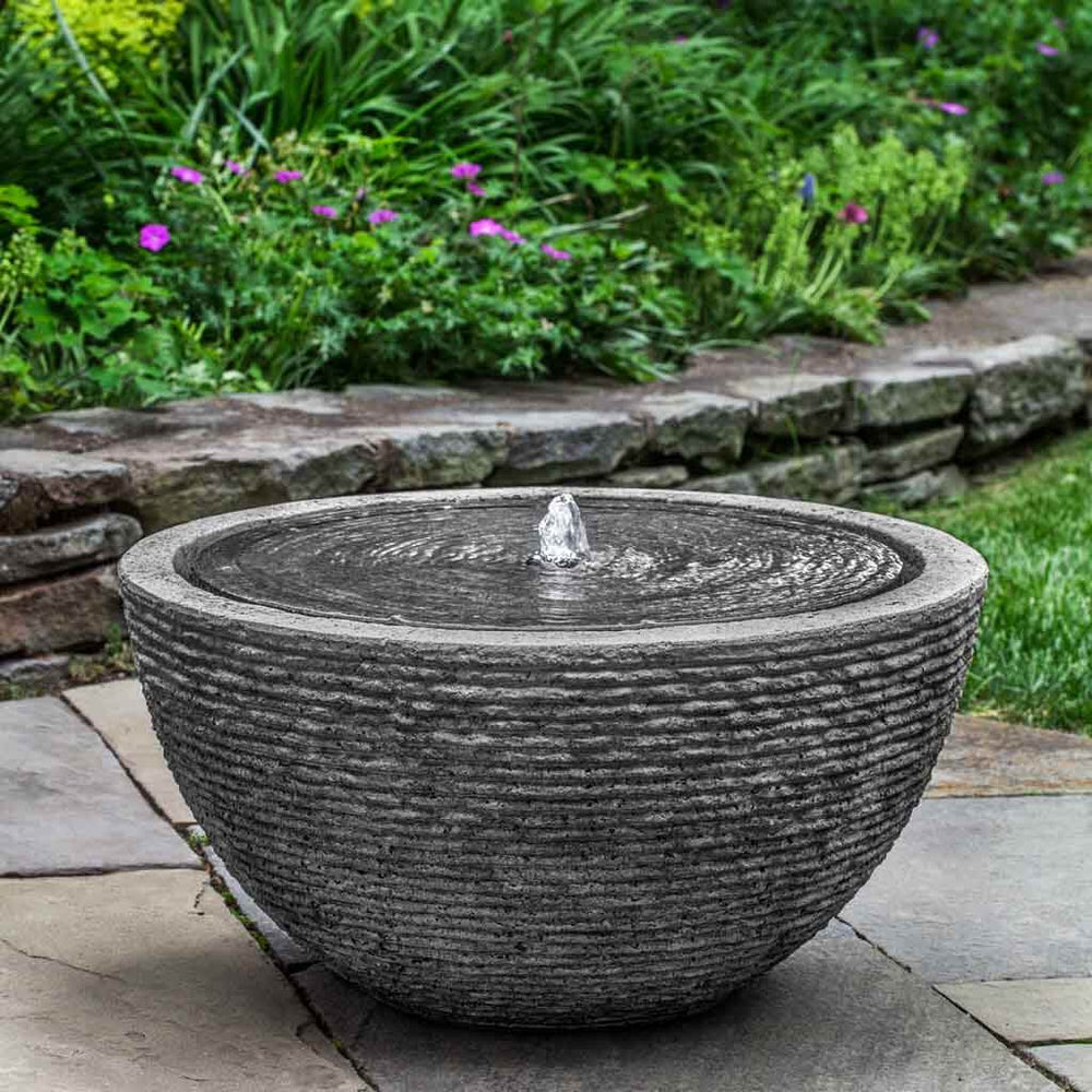 Large Stone Ledge Arroyo Garden Bubbler fountain in action on patio