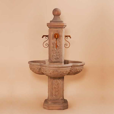 Limone Courtyard Fountain against brown background.