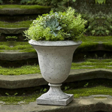 Linwood Urn Planter on stairs in the backyard