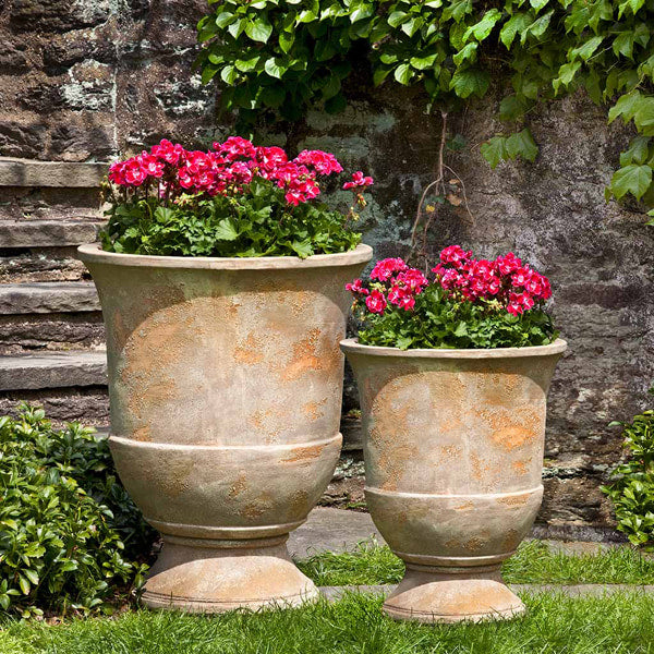 Lipari Urn Antico Terra Cotta S/2 on grass in the backyard.