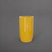 Lisbon Tall Round Tapered Fiberglass Planter in gloss saffron against gray background.