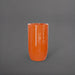 Lisbon Tall Round Tapered Fiberglass Planter in gloss tangerine against gray background.