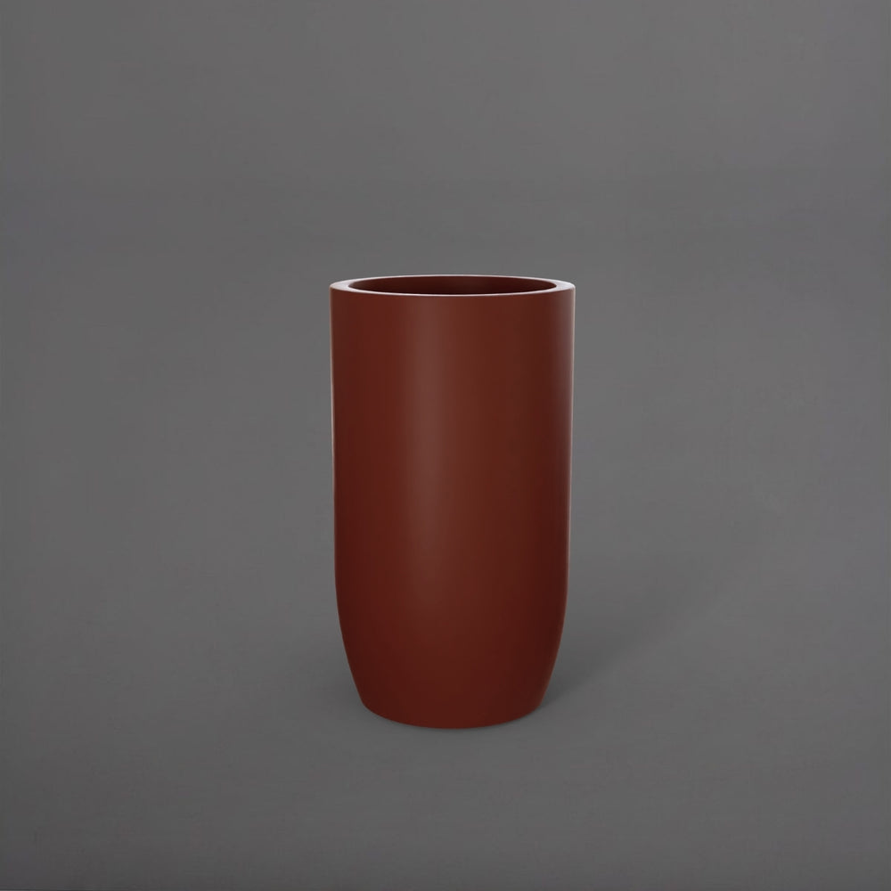 Lisbon Tall Round Tapered Fiberglass Planter in matte terra cotta against gray background.