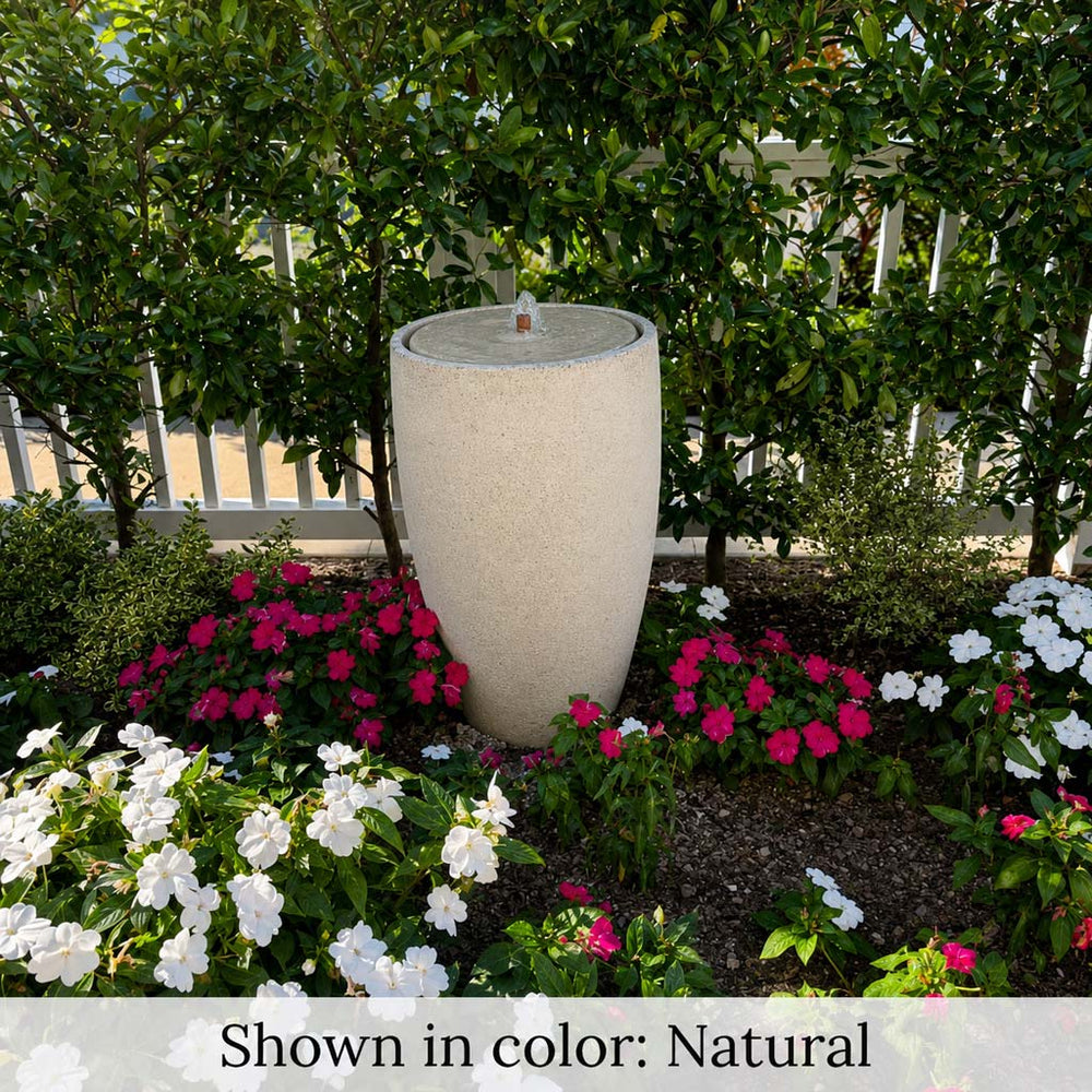 Manzanita Fountain in action surrounded with flowers.