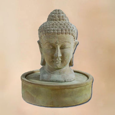 Meditation Buddha Fountain against brown background.