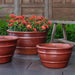 Mera Planter in Brunello on concrete in the backyard.