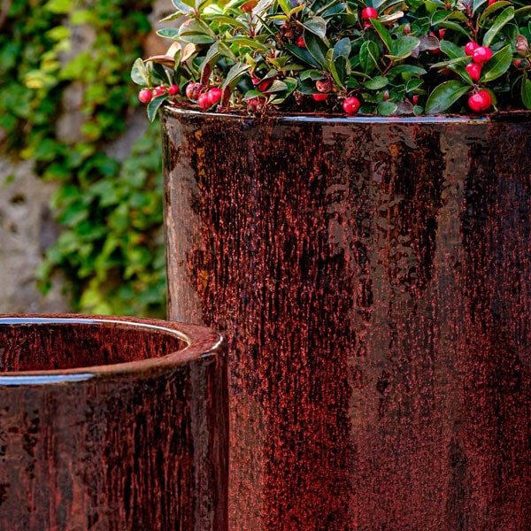 Merlot Planter on gravel filled with plants uplose