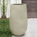 Mews Planter, Large - Ivory Lite on concrete filled with plants