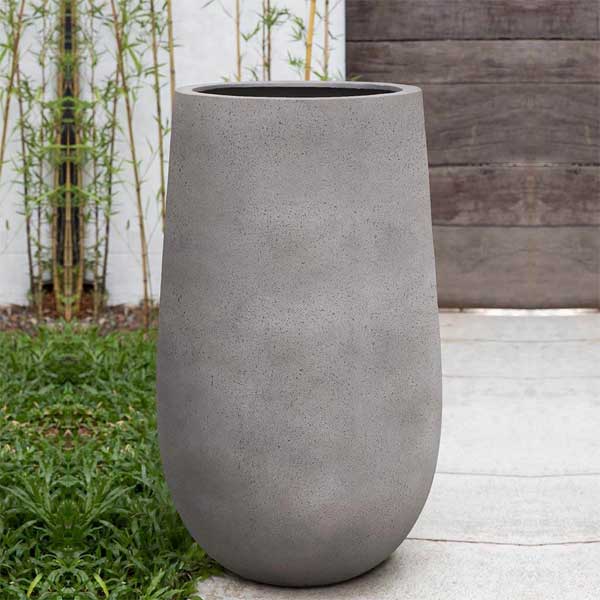 Mews Planter, Large - Stone Grey Lite on concrete filled with plants