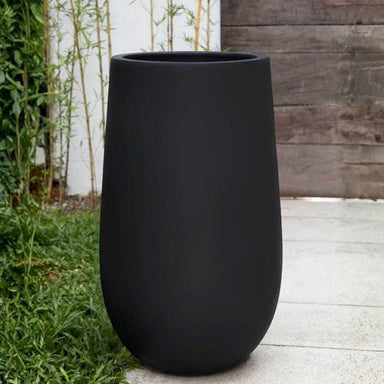 Mews Planter, Small in onyx black lite on concrete in the backyard.
