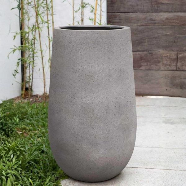 Mews Planter, Small in stone grey lite on concrete in the backyard.