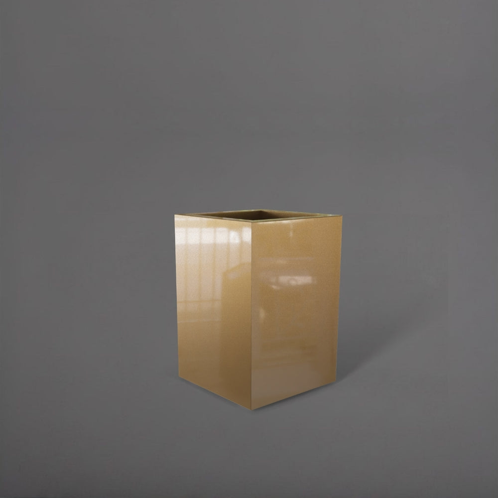Miami Short Corner Fiberglass Planter in gloss metallic gold against gray background.