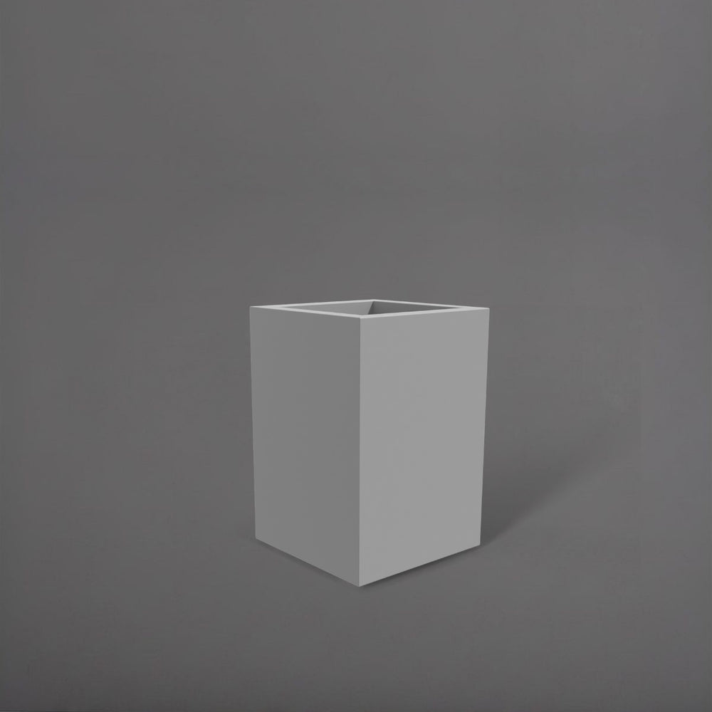 Miami Short Corner Fiberglass Planter in matte cement grey against gray background.
