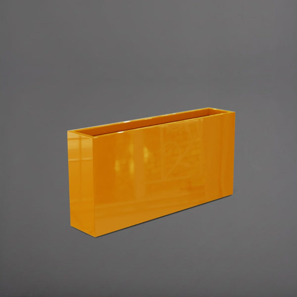 Milano Narrow Rectangle Planter in gloss tangerine against gray background