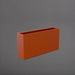 Milano Narrow Rectangle Planter in matte terracotta against gray background.