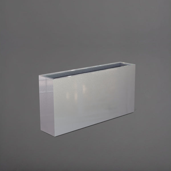 Milano Narrow Rectangle Planter in metallic silver against gray background.