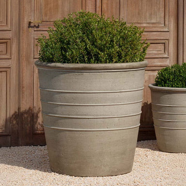 Mill Valley Planter, 36 inch on gravel filled with plants.