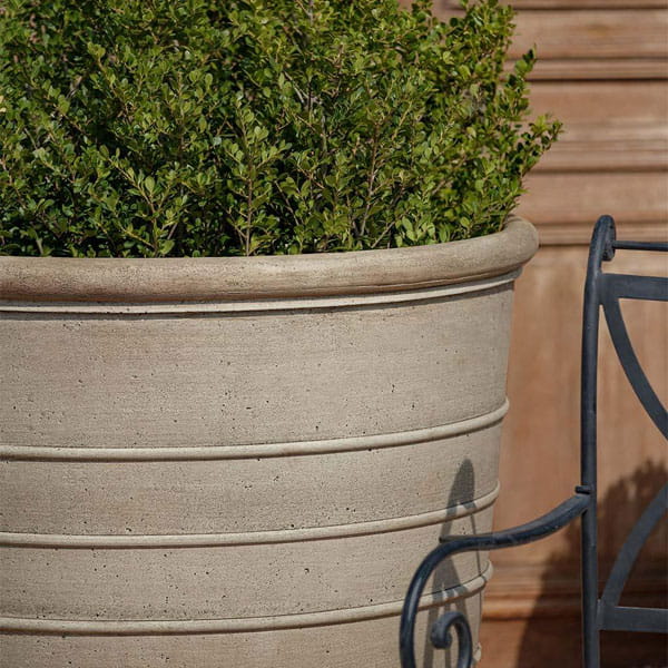 Mill Valley Planter up-close filled with plants in the backyard.