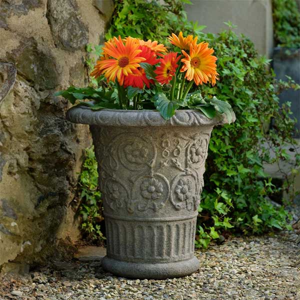 Minerva Planter filled with orange flowers in the backyard